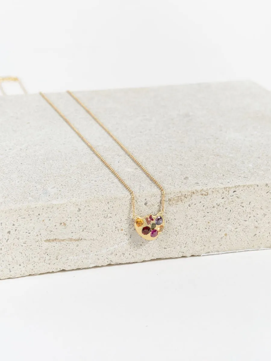eroded disc necklace with rainbow sapphires