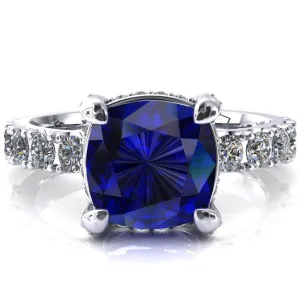 Grandeur Cushion Blue Sapphire 4 Prong Basket and Half Eternity Fire Ring