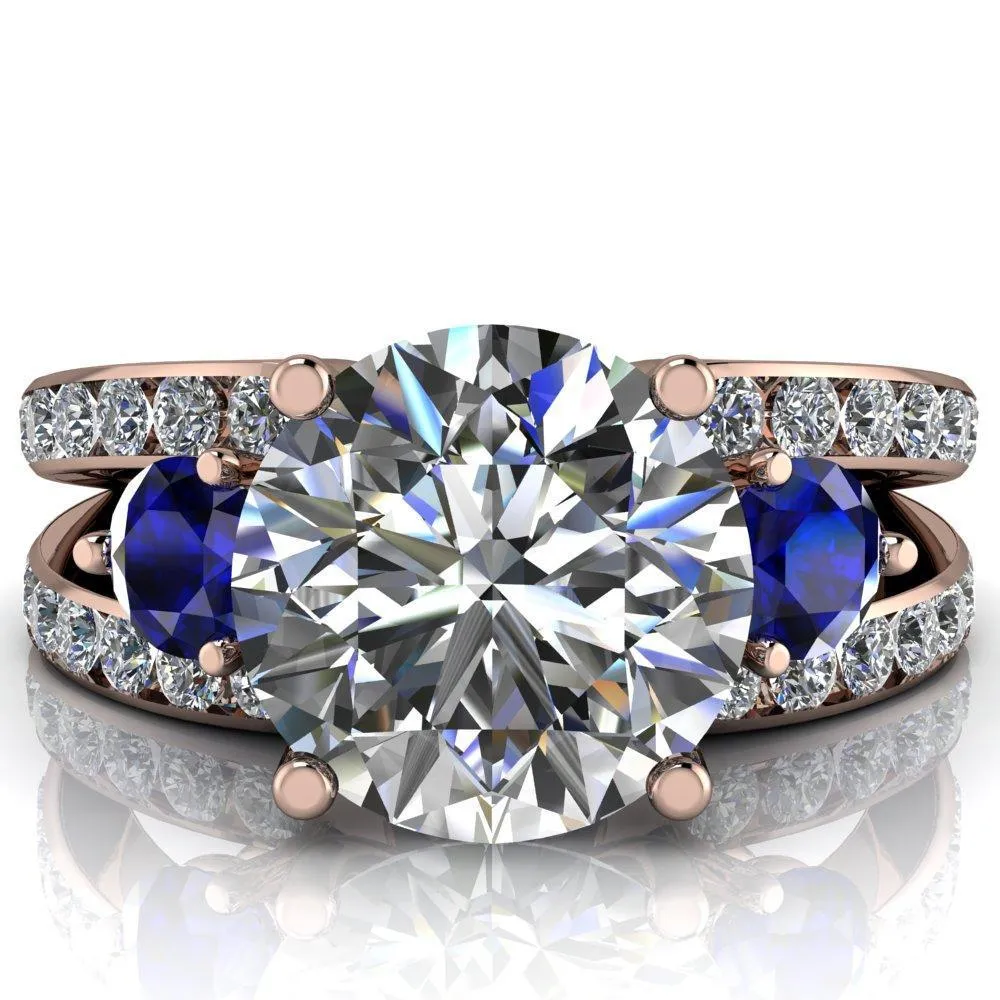 Orion Round Center Stone 2 Round Blue Sapphire Sides Split Shank Diamond Channel Set Ring