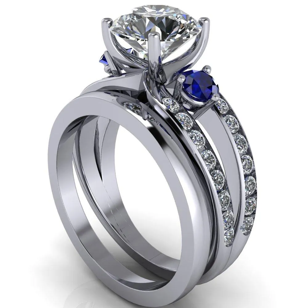 Orion Round Center Stone 2 Round Blue Sapphire Sides Split Shank Diamond Channel Set Ring