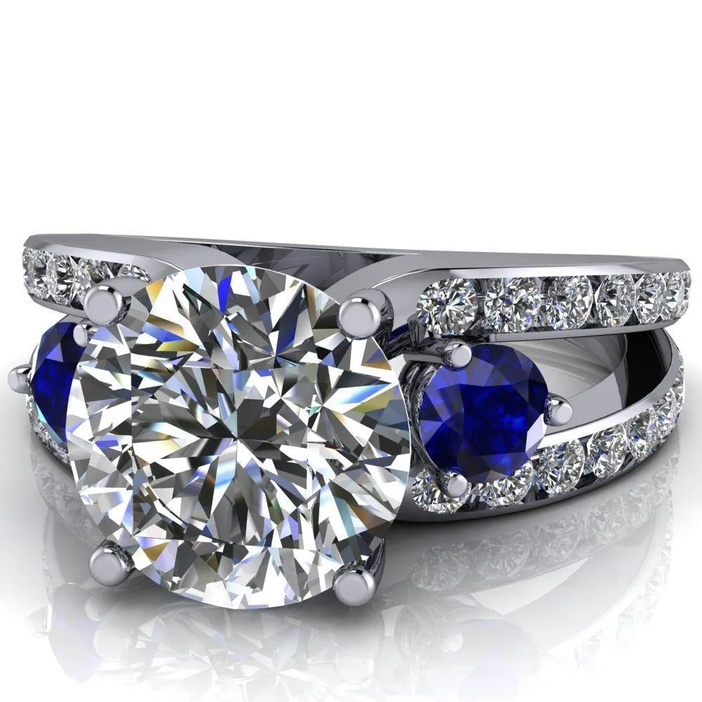Orion Round Center Stone 2 Round Blue Sapphire Sides Split Shank Diamond Channel Set Ring