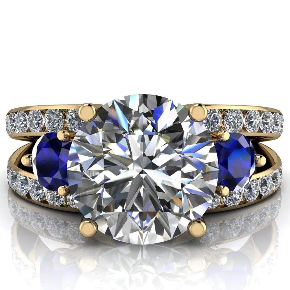 Orion Round Center Stone 2 Round Blue Sapphire Sides Split Shank Diamond Channel Set Ring