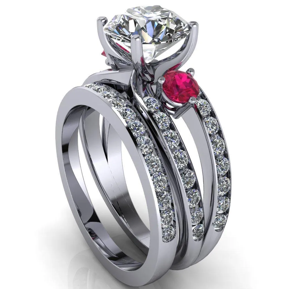 Orion Round Center Stone 2 Round Ruby Sides Split Shank Diamond Channel Set Ring