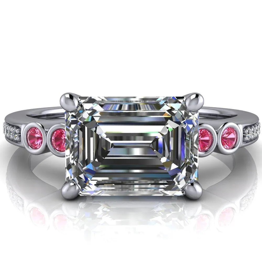 Philippa Emerald Moissanite 4 Pink Sapphire Sides 4 Prong Under Bezel Multi Stone Engagement Ring